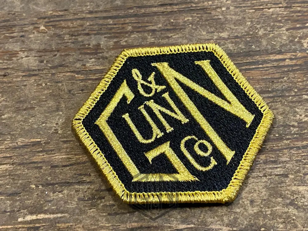 Gunn & Co Gold And Black Embroidered Cloth Badge. Badge