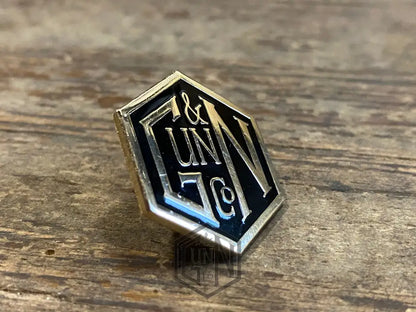 Gunn & Co Gold And Black Enamel Lapel Pin Badge. Badge